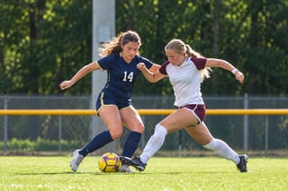 Fictional player contesting the ball